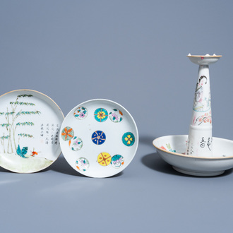 A Chinese qianjiang cai candle holder and two famille rose and verte saucer dishes, 19th/20th C.
