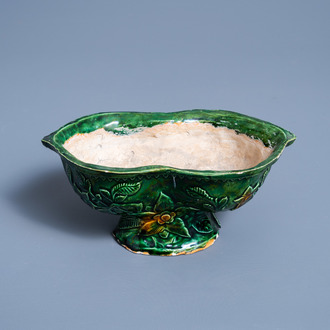 A French green glazed lobed bowl on foot with floral design, Apt or Saint-Quentin, 18th/19th C.