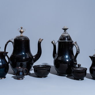 Five various black glazed Namur pottery jugs and two bowls, some pieces silver mounted, 18th C.