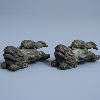 A pair of Chinese bronze models of Buddhist lions, Qing