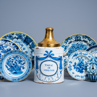 A Brussels blue and white tobacco jar, six Dutch Delft plates with floral design and a holy water font, 18th C.