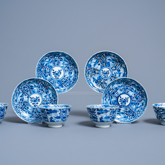 Four Chinese blue and white cups and saucers with floral design and animated landscapes, 19th C.