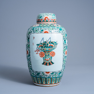 A large Chinese famille verte jar and cover with flower baskets and floral design, 19th C.
