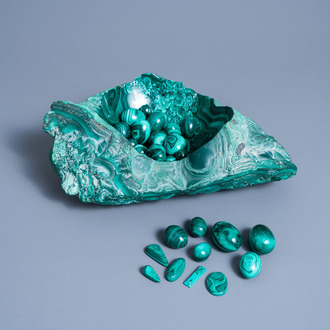 A large partly polished malachite bowl with an extensive collection of malachite eggs, presumably Congo, 20th C.