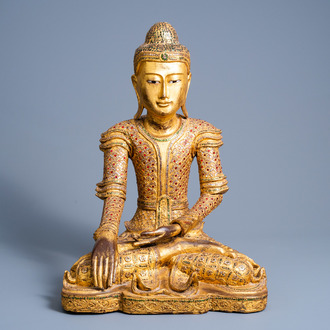 A tall inlaid gilt wood figure of a seated Buddha, Burma or Thailand, 20th C.