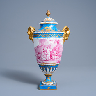 A French gold layered 'bleu celeste' ground vase and cover with putti in a landscape and ram's heads, Sèvres mark, 19th C.