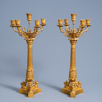 A pair of large French gilt bronze five-light candelabra with winged lions, 19th C.