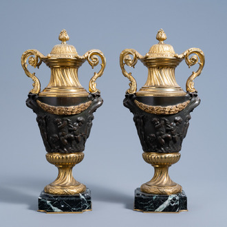 A pair of French gilt and patinated bronze cassolettes with bacchantes relief design on a marble base, 19th C.