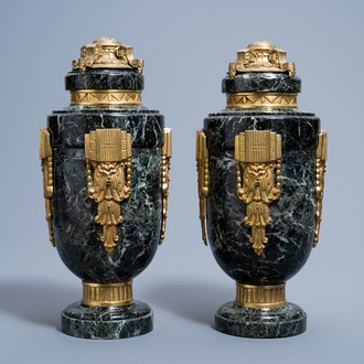 A pair of Art Deco gilt bronze mounted vert de mer marble cassolettes, first half of the 20th C.