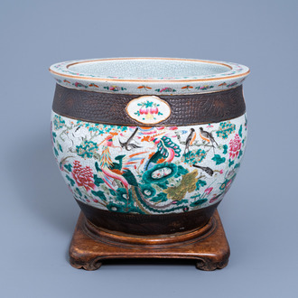A Chinese Nanking crackle glazed famille rose jardinière with birds among blossoming branches, 19th C.