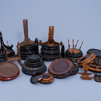 A collection of Chinese carved wood stands and plate holders, 20th C.