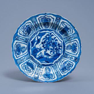 A Chinese blue and white kraak porcelain charger with birds among blossoming branches, Wanli