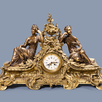 A large French gilt brass mantel clock depicting science, 19th/20th C.