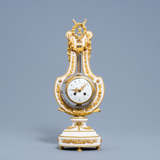 A French Neoclassical gilt bronze and white marble lyre clock, second half of the 19th C.