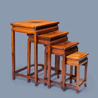 Four Chinese rectangular wood gigogne side tables, 20th C.