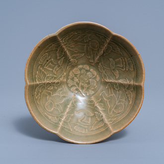 A Chinese lotus-shaped celadon glazed bowl with floral sprigs and boys, 19th/20th C.