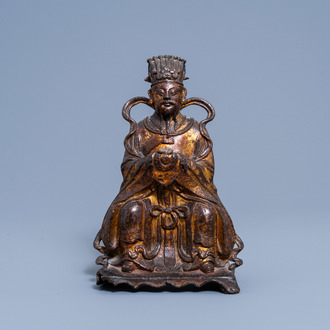 A Chinese lacquered and gilt bronze figure of Wenchang Wang on a throne, Ming