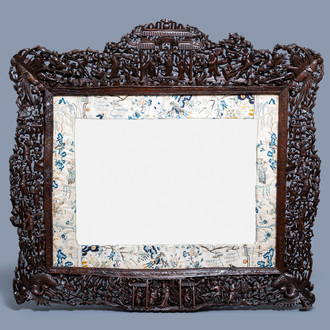 A large finely carved Chinese wooden mirror frame with silk embroidery, Canton, 19th C.