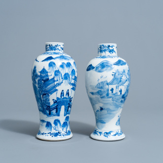 Two Chinese blue and white baluster shaped vases with an animated mountain landscape all around, Kangxi mark, 19th C.