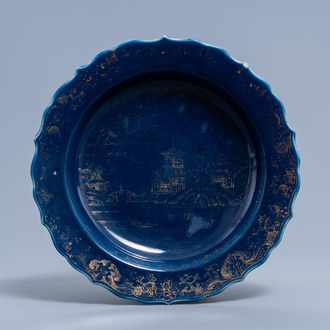 A Chinese powder blue and gilt lotus-shaped 'landscape' charger, Qianlong mark and of the period