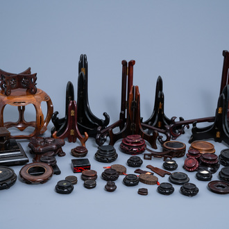 A collection of Chinese carved wood stands and plate holders, 19th/20th C.