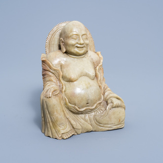 A Chinese carved soapstone figure of a laughing Buddha, 20th C.