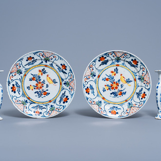 A pair of Dutch Delft polychrome plates with a bird on a blossoming branch and a pair of blue and white vases with floral design, 18th C.