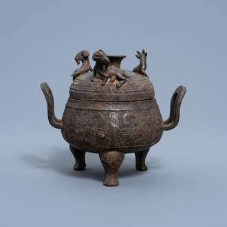 A Chinese bronze tripod censer and cover, Xuande mark, Ming