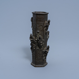 A Chinese bronze vase with relief design of immortals, Ming