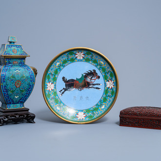 A Chinese red lacquer box and cover with an animated landscape and a cloisonné vase and cover and dish, 19th/20th C.