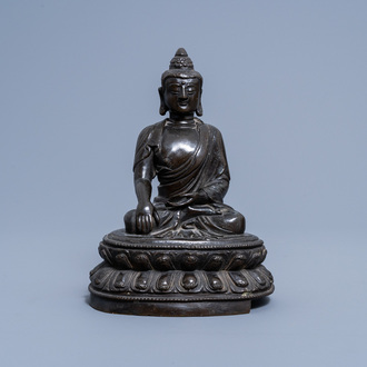 A Chinese bronze figure of Buddha on a lotus throne, 17th/18th C. or later