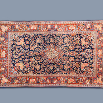 An Oriental Kashan rug with floral design, wool on cotton, Persia, second quarter of the 20th C.