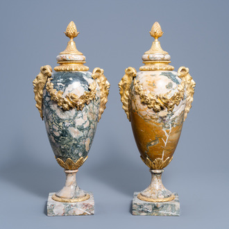 A pair of gilt bronze mounted marble cassolettes with satyr heads, 19th/20th C.