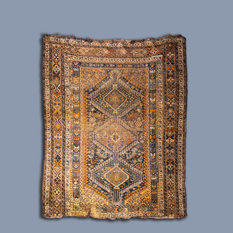 A Persian Qashqai triple medallion rug, wool on cotton, 19th C.