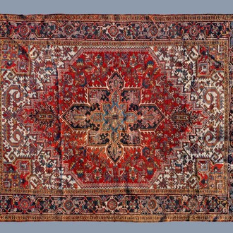 A Persian Heriz rug with floral design, wool on cotton, first quarter of the 20th C.