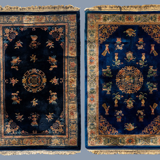 Two Chinese woolen 'Beijing' carpets with antiquities design, 20th C.