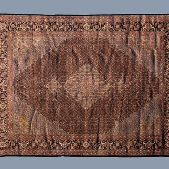 A Sino-Tabriz rug with floral design, wool on silk, China, mid 20th C.