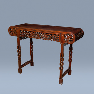 A Chinese carved hardwood 'dragons chasing the pearl' altar table, 20th C.
