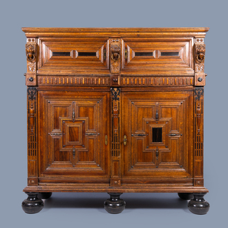 A Dutch oak wood cupboard 'Zeeuwse kast' with geometric pattern, flanked by lions and ebony and rosewood details, 17th C. and later