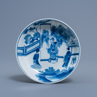 A Chinese blue and white saucer with a kneeling lady with a request, Chenghua mark, Kangxi