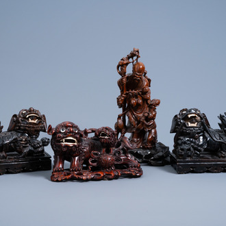Four Chinese carved wood figures of Shou Lao and Buddhist lions, 19th/20th C.