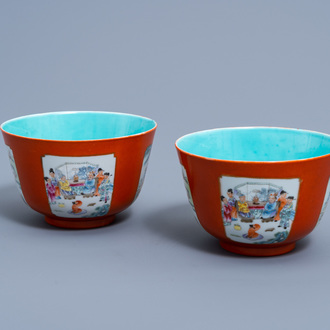 A pair of Chinese famille rose coral red ground bowls with animated scenes, Qianlong mark, 19th/20th C.