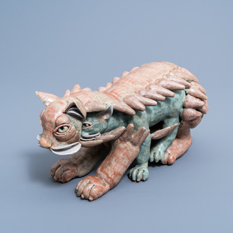 European school: A figure of a feline mythical animal in polychrome glazed terracotta, 20th C.