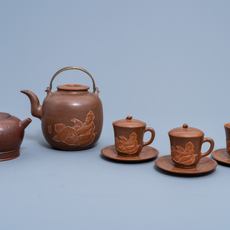 A Chinese Yixing stoneware 'scholar' tea service and a teapot and cover with a religious text, 20th C.