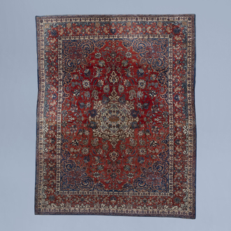 An Oriental Isfahan rug with floral design, wool and silk on cotton, Iran, third quarter of the 20th C.