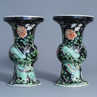 A pair of Chinese famille noire vases with pheasants and flowers, 20th C.