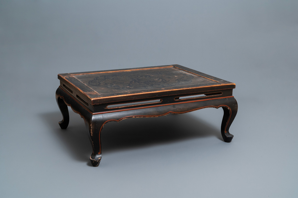 A Chinese black- and red-lacquered wooden 'dragon' table, 19th C.